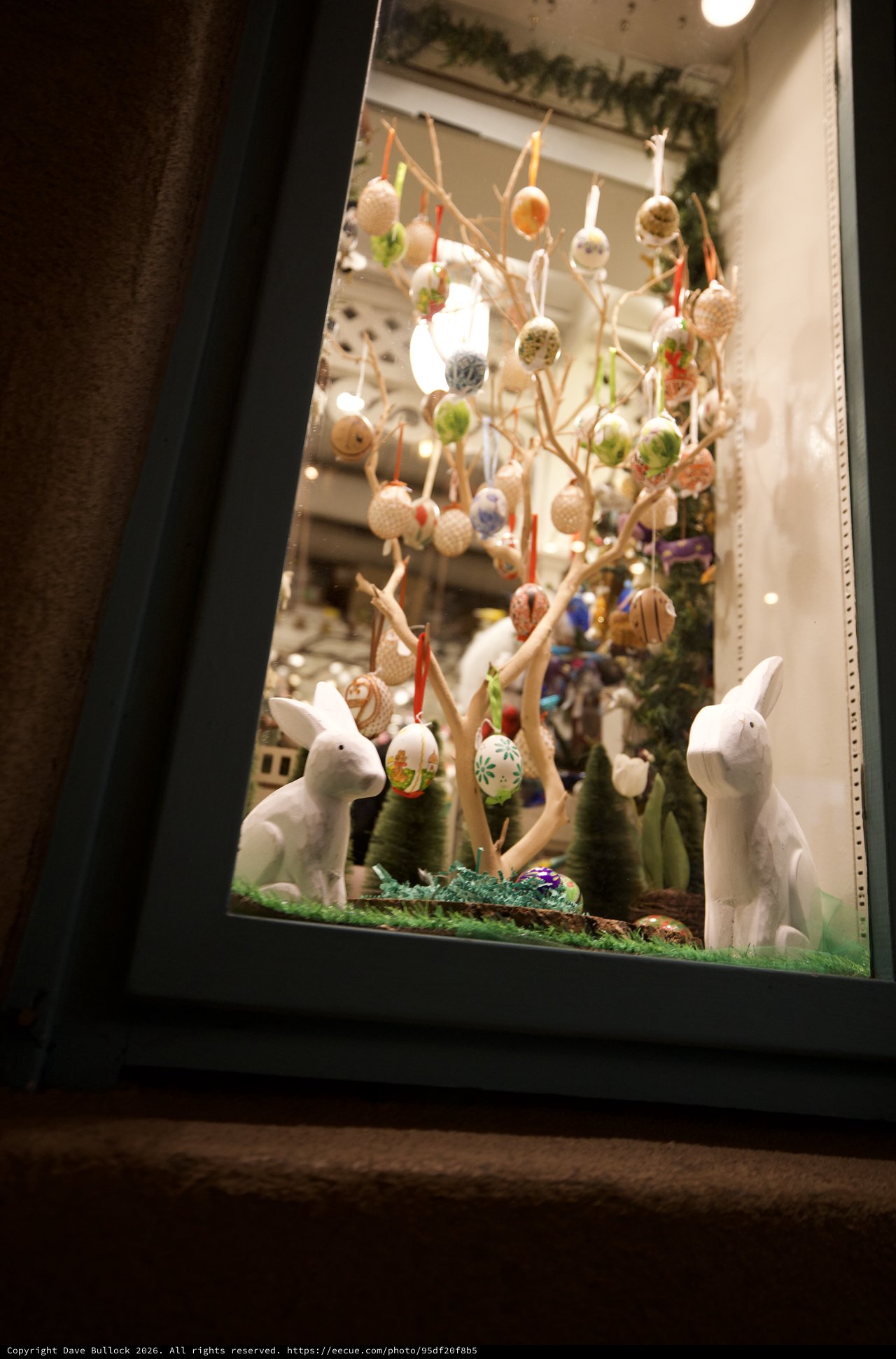 Easter Window Display with Decorated Eggs and Rabbits