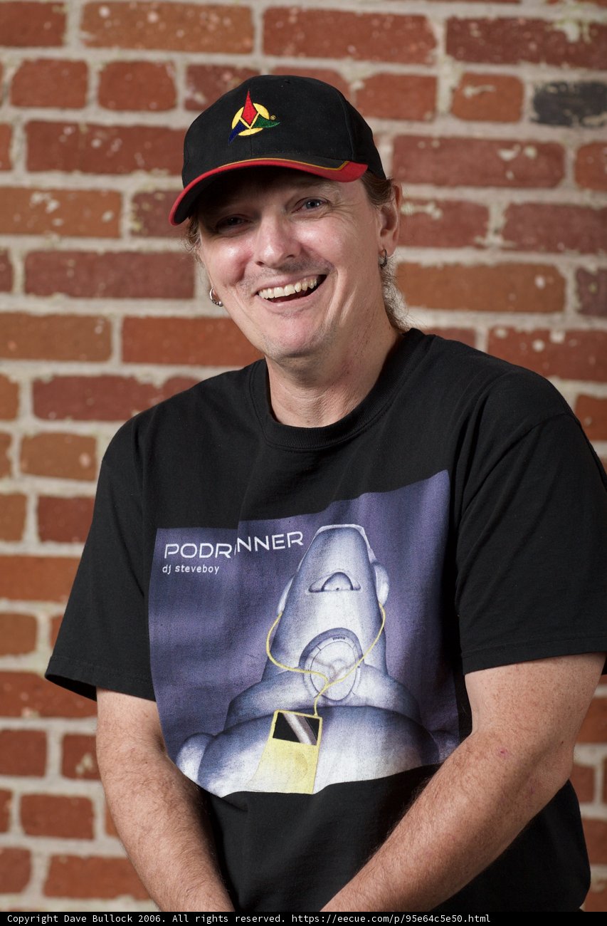 Smiling Man in Black Hat and T-Shirt