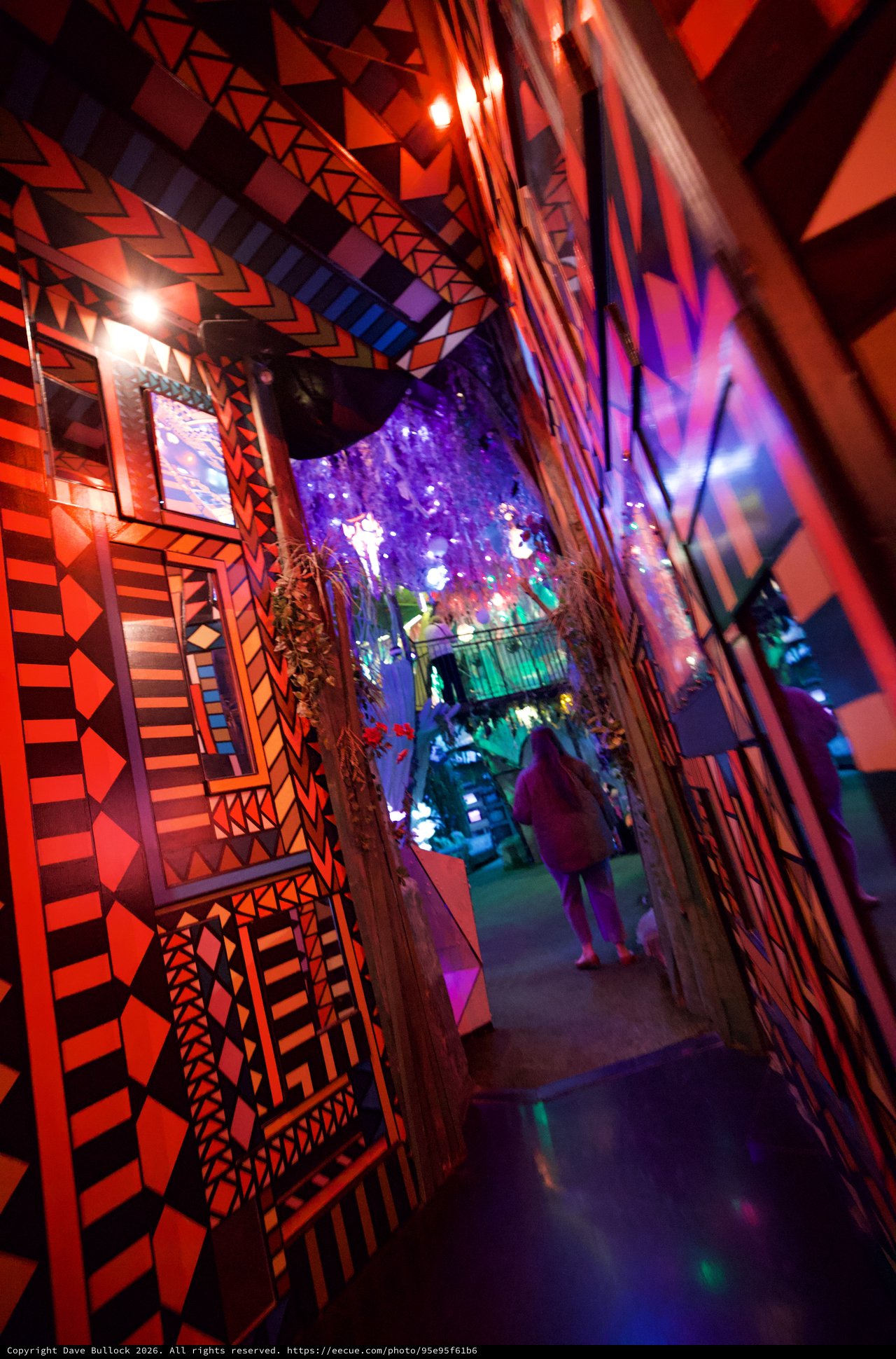 Vibrant Geometric Corridor with Illuminated Art Installation
