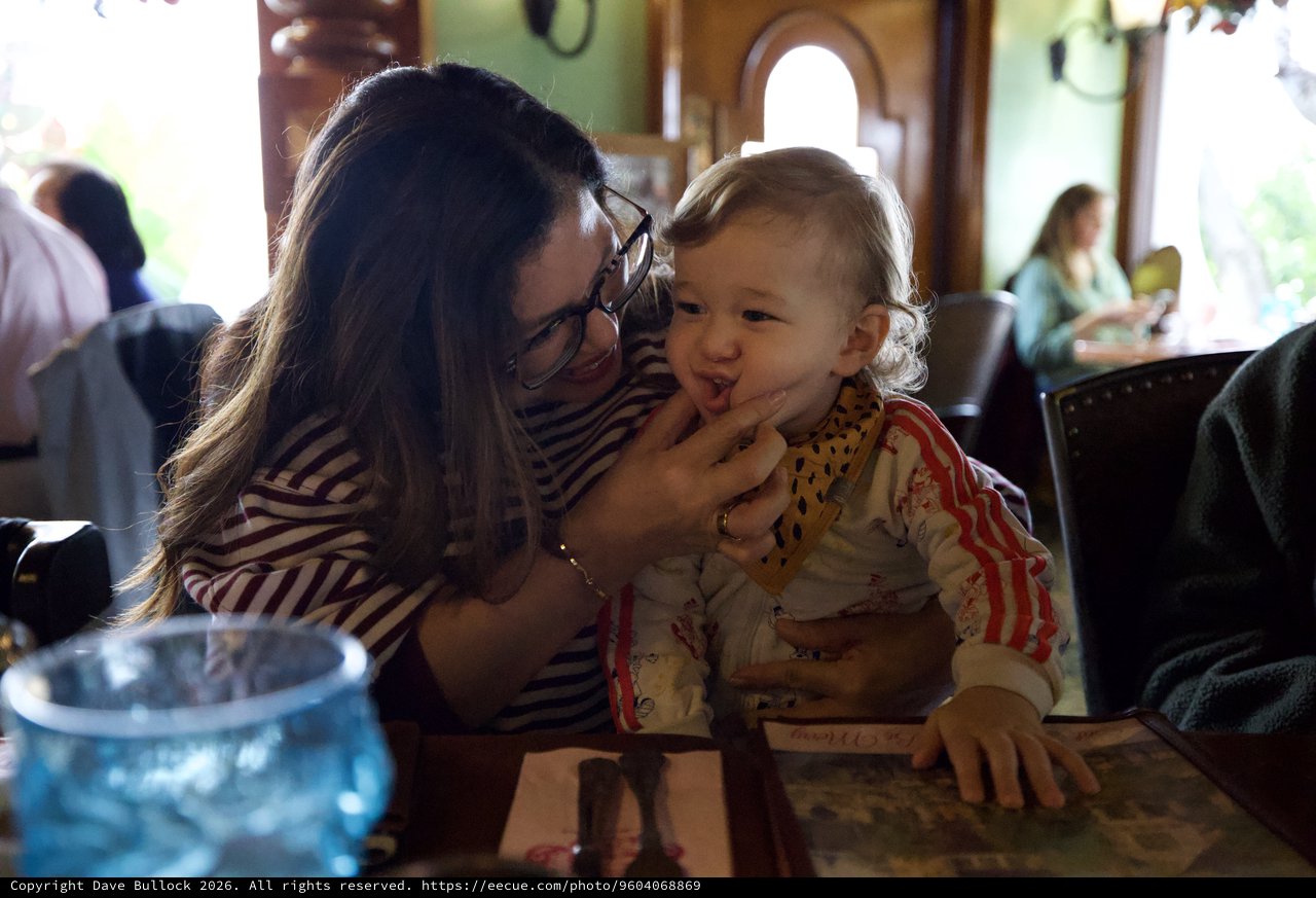 Mother and Child Sharing Sweet Moment at Restaurant