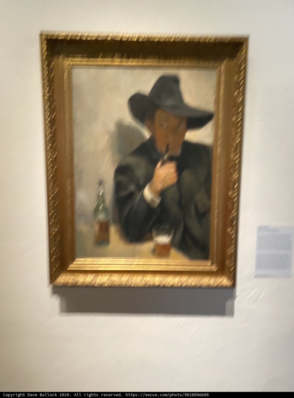 Man in a Hat with a Bottle