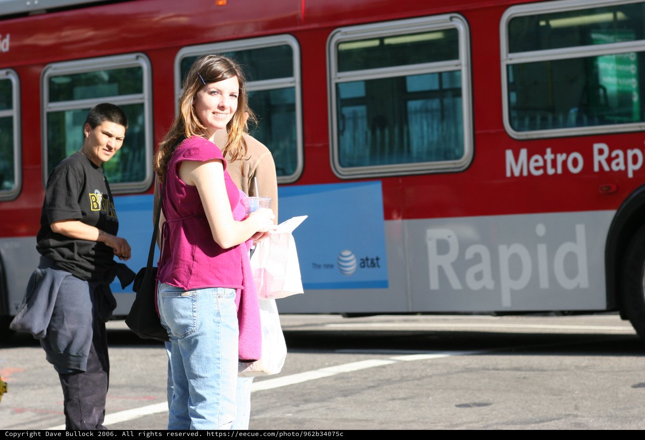 Young Woman Smiling at LA Metro Rapid Bus Stop