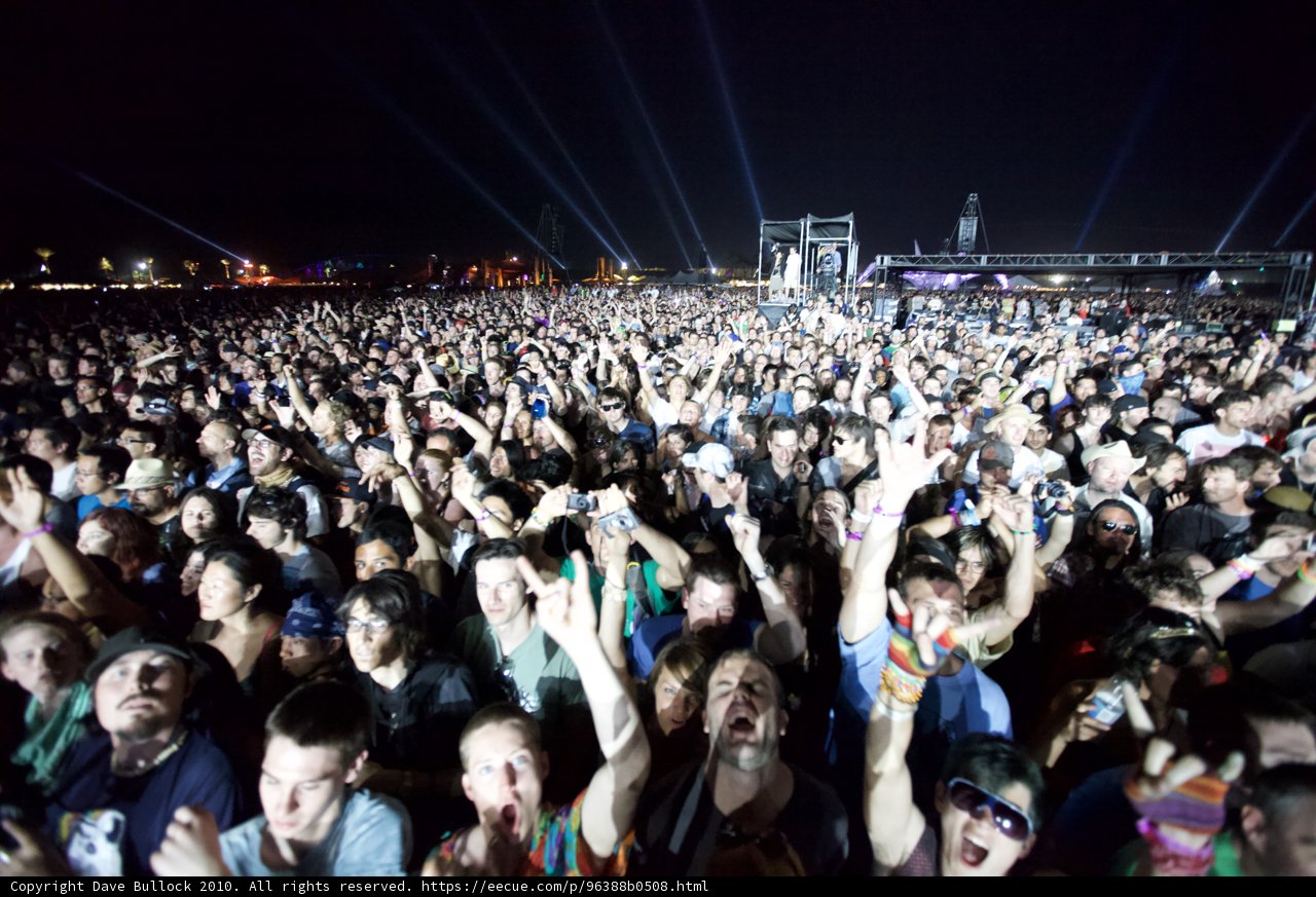 Hands Up in the Night Sky: A Concert Crowd Comes Alive