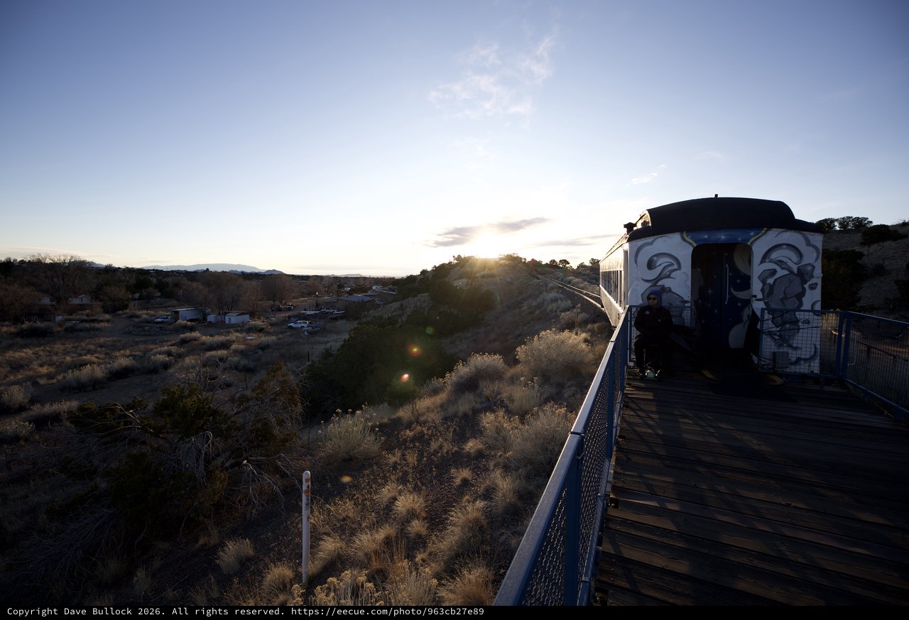 Sunset Train Journey Through Desert Landscape