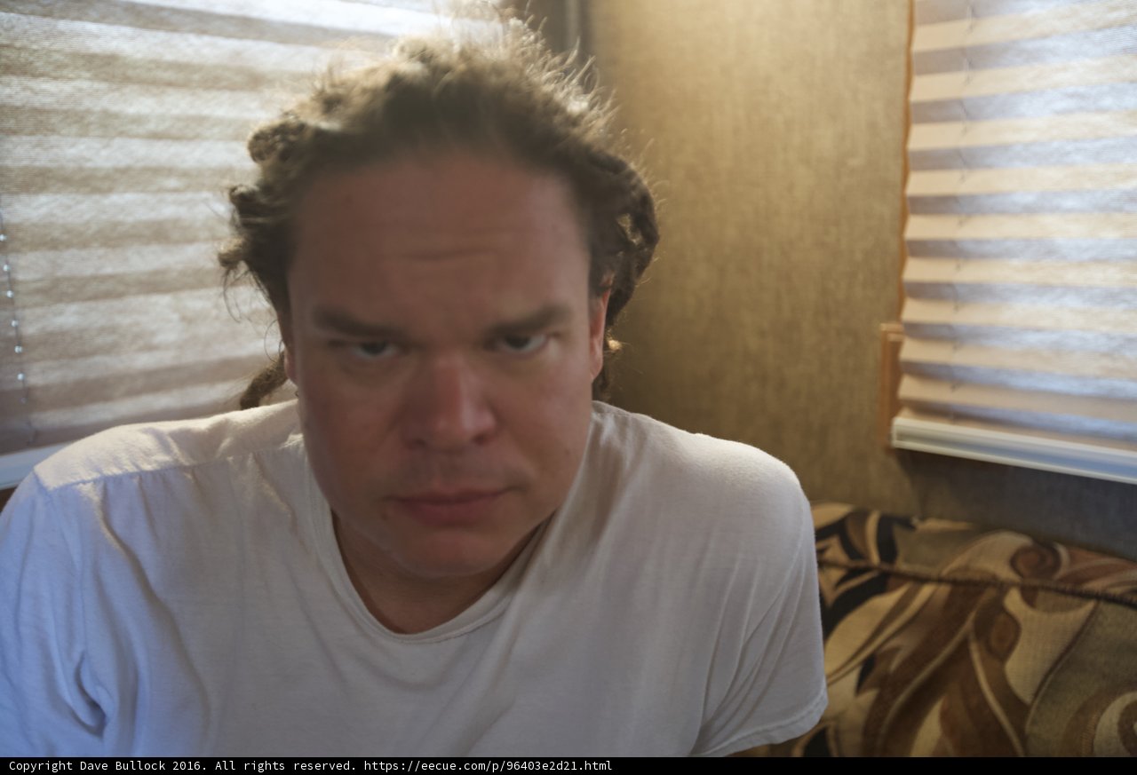 Sad Man on White Couch