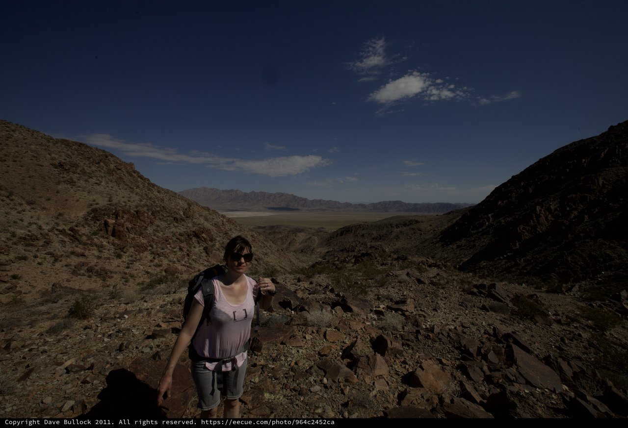 Desert Hiker Ascending Rocky Canyon Pass