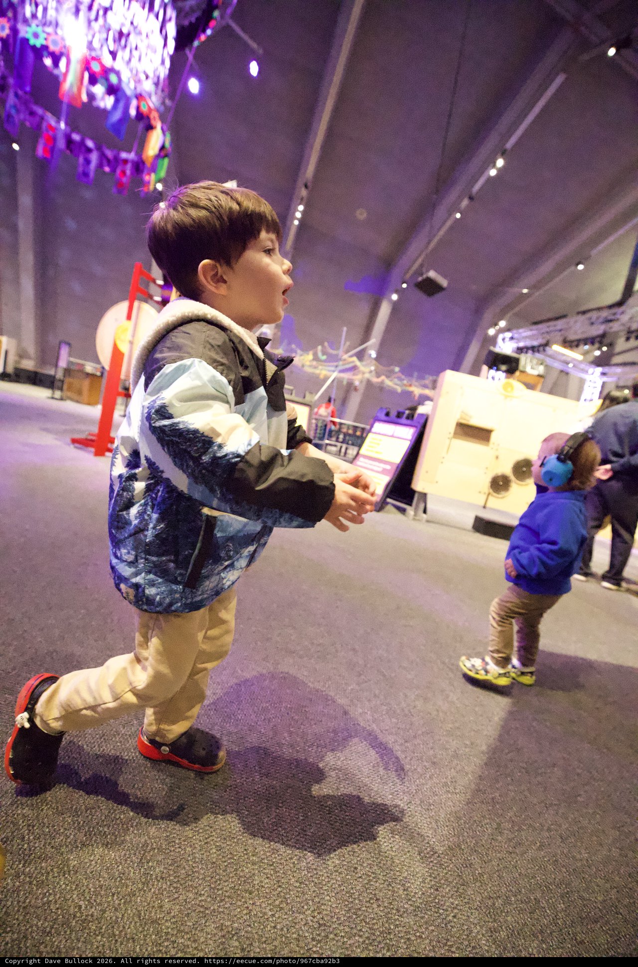 Young Boy Explores Interactive Science Museum Exhibit