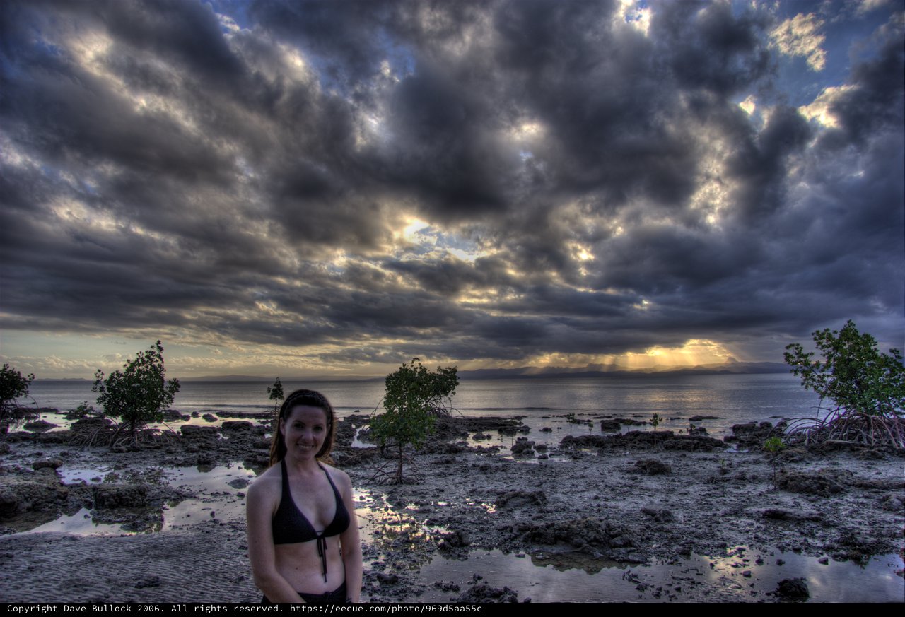 Storm Light Over Fiji's Rocky Coastline at Sunrise
