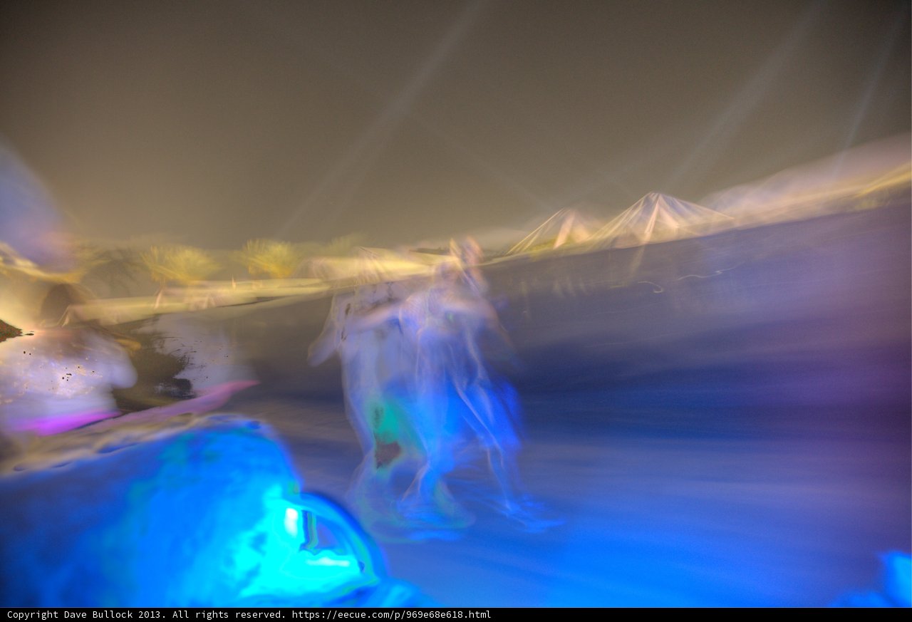 Blurry Snowboarders in the Moonlight