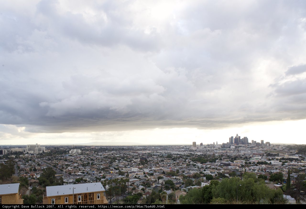 A Glimpse of the City from the Cloudy Horizon