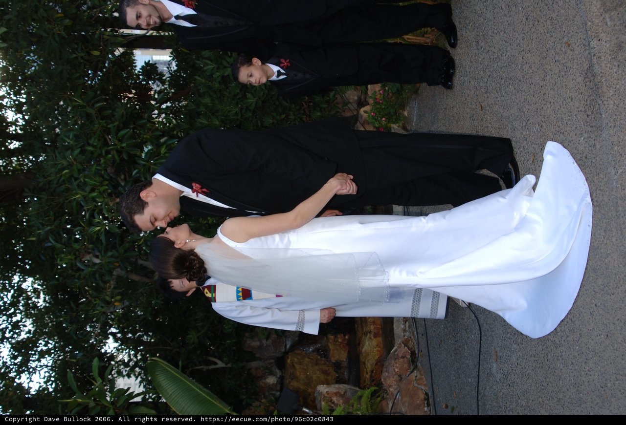 Bride and Groom Share First Kiss at Outdoor Wedding