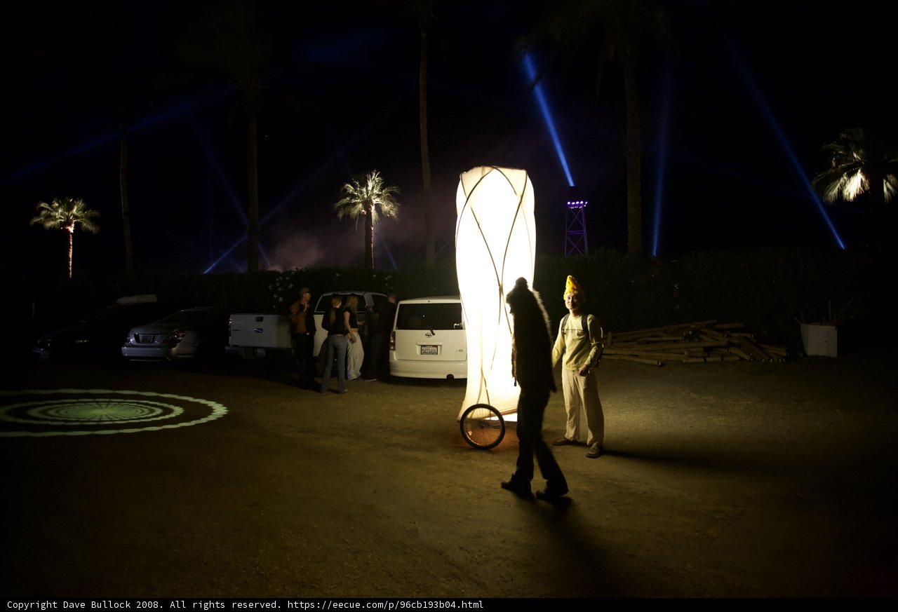 Lighted Machine Towering Over Sho Nakata