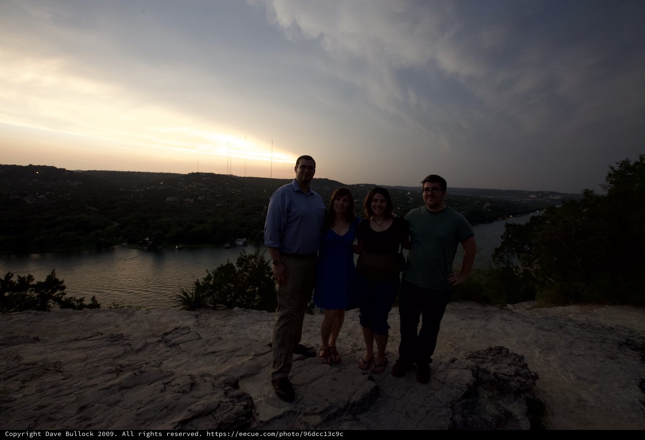 Friends Pose at Sunset Overlook Above Austin River