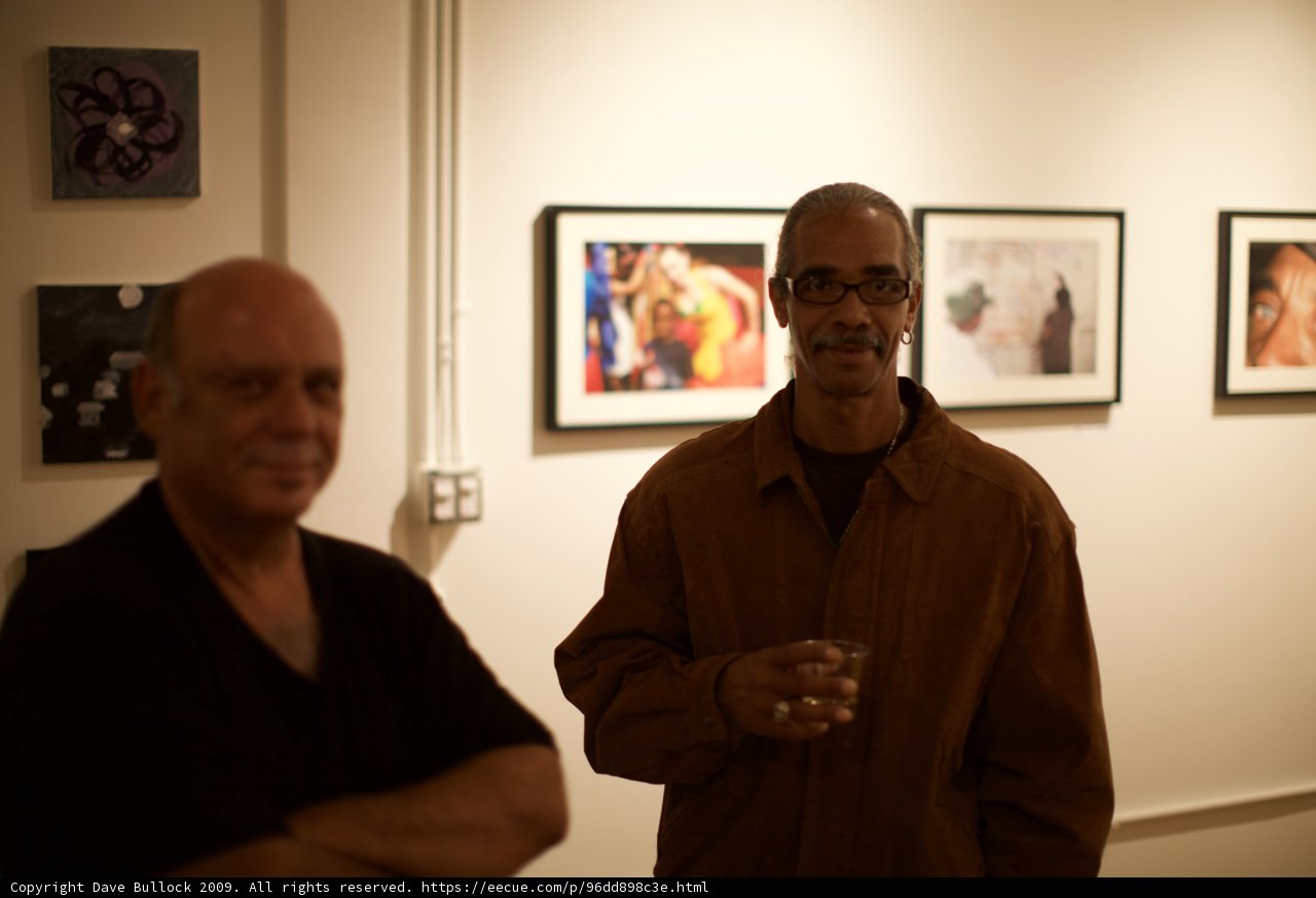 Two Men Admiring Art in Gallery