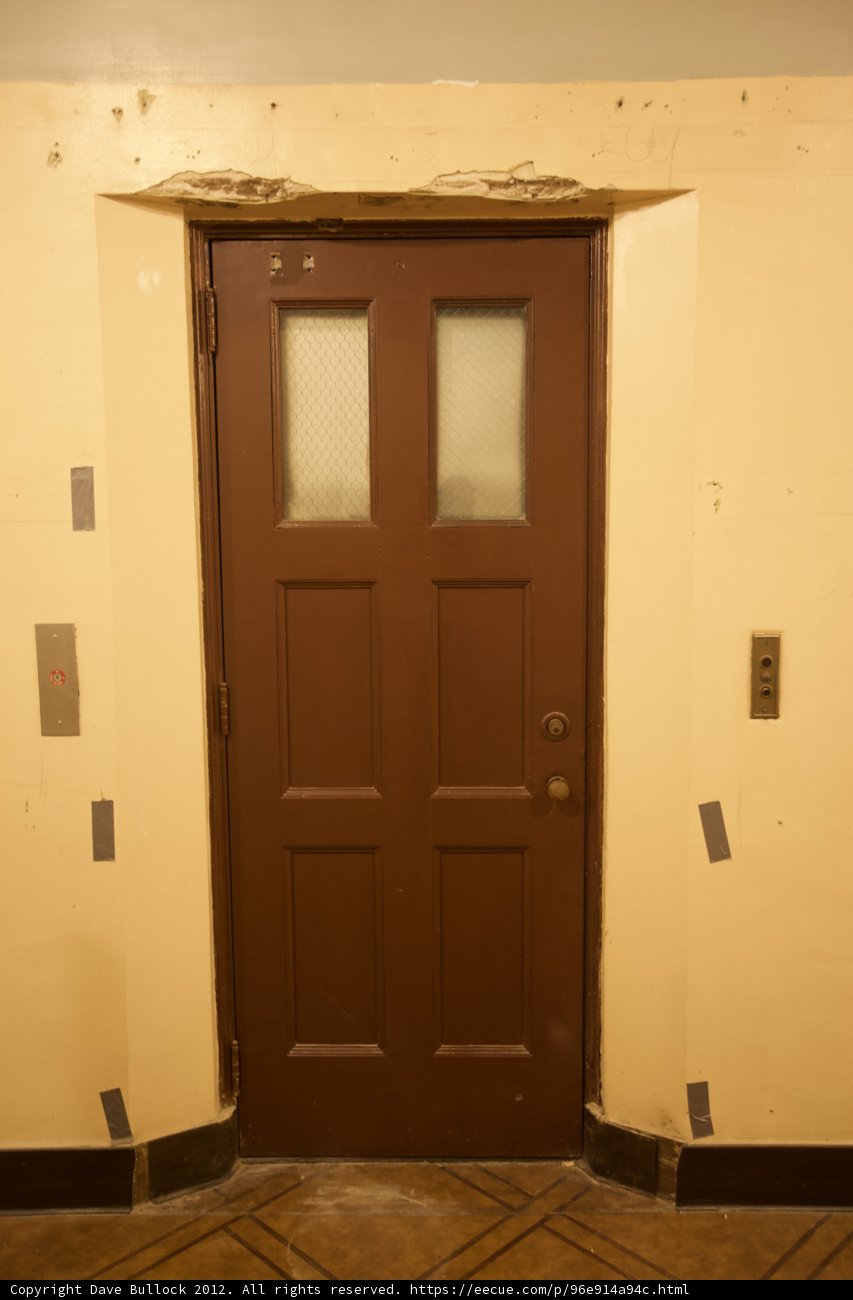 Rustic Brown Door in White Room