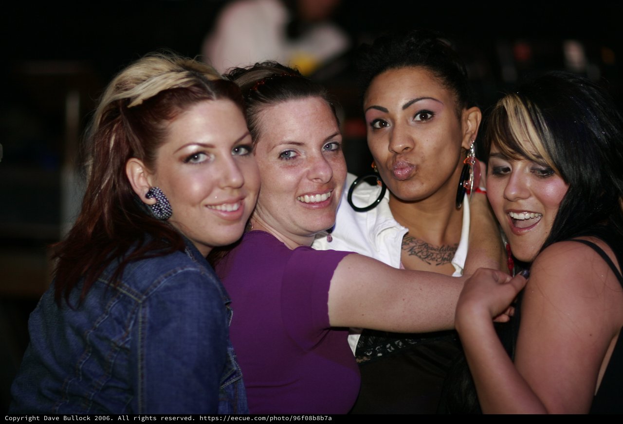 Four Friends Celebrating Together at a Nightclub