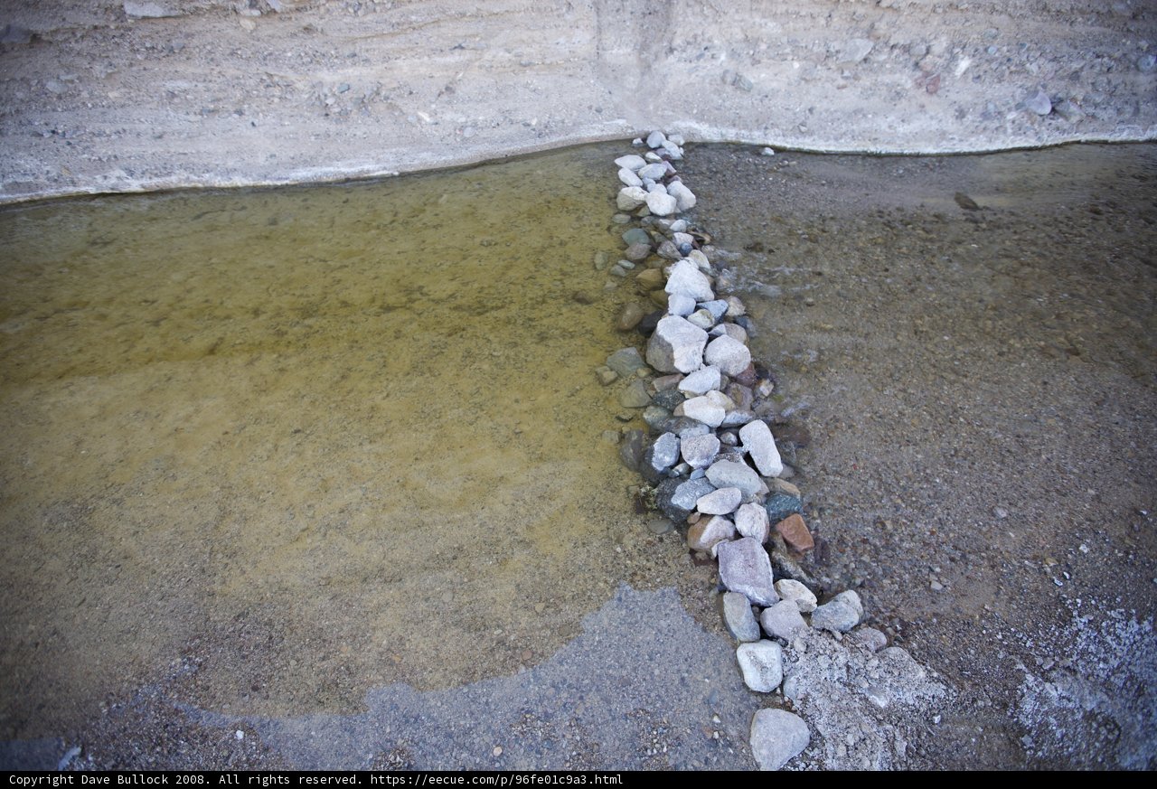 A Delicate Stream Carving Through the Rocks