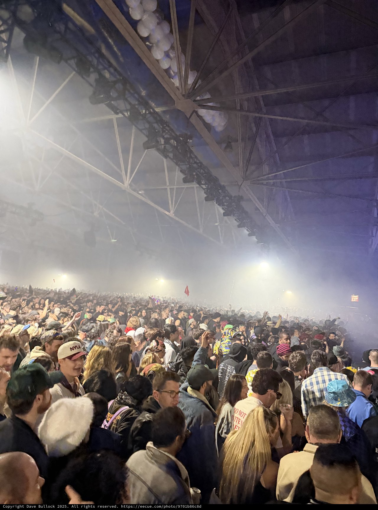 Massive Indoor Concert Crowd Under Dramatic Stage Lighting