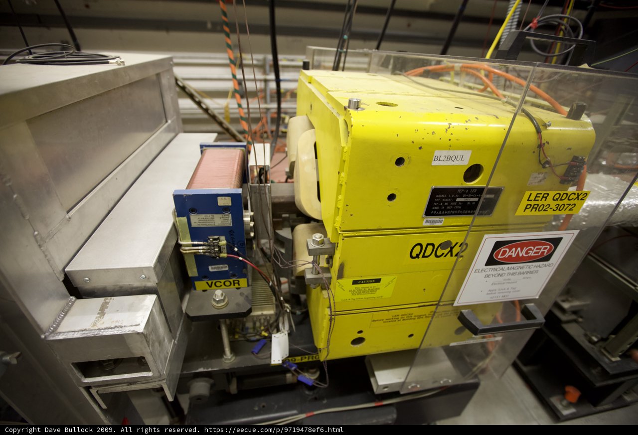 Yellow Machine with Factory Sign