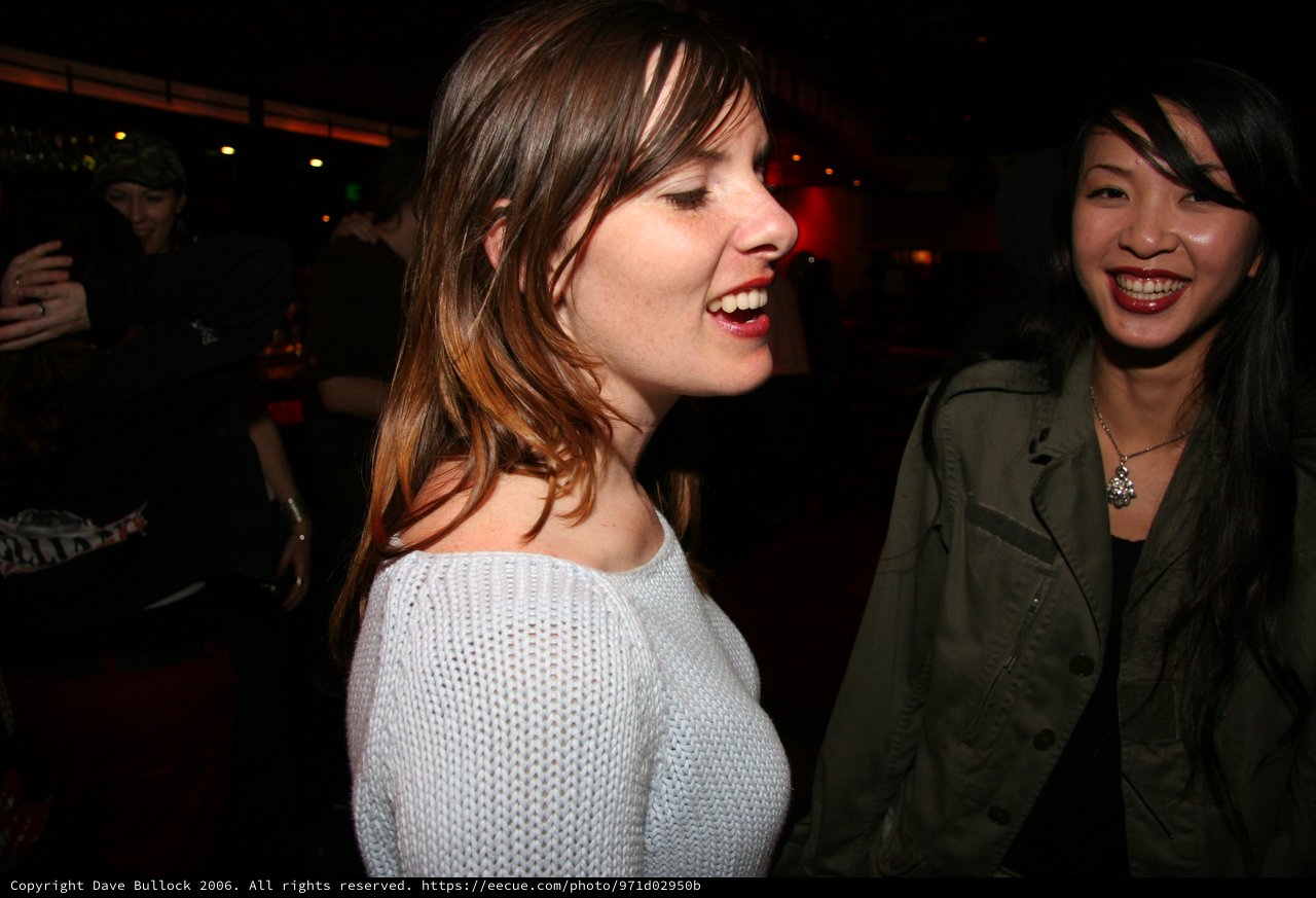 Two Women Laughing at a Nightclub Party