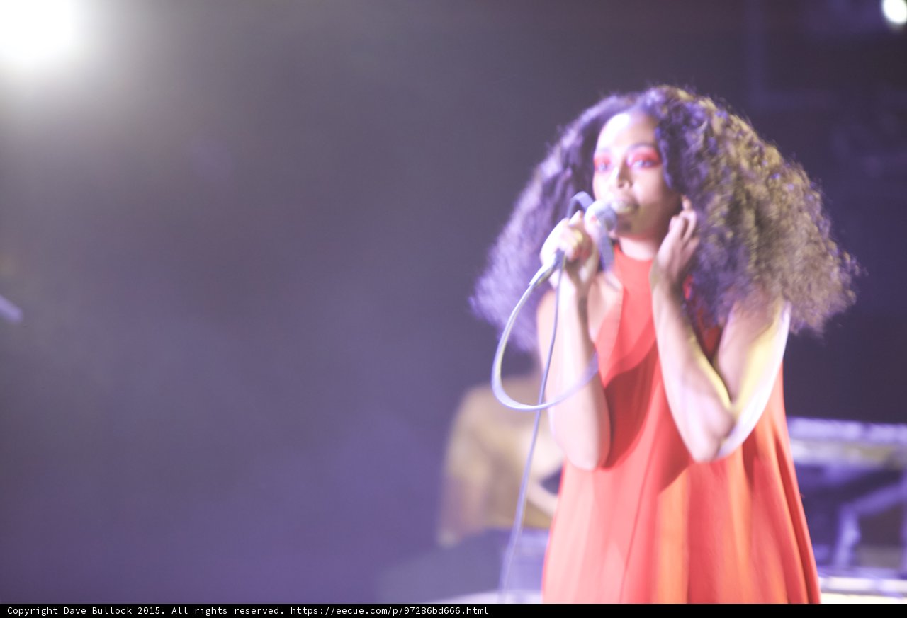 Solange Singing Full Body Red Dress Guitarist Background