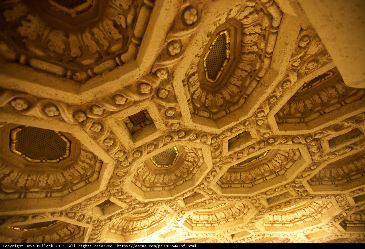 Intricate carvings on theater ceiling