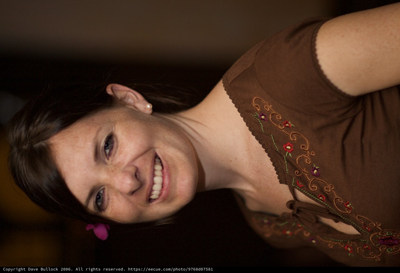 Smiling Woman with Flower at Art Walk Event
