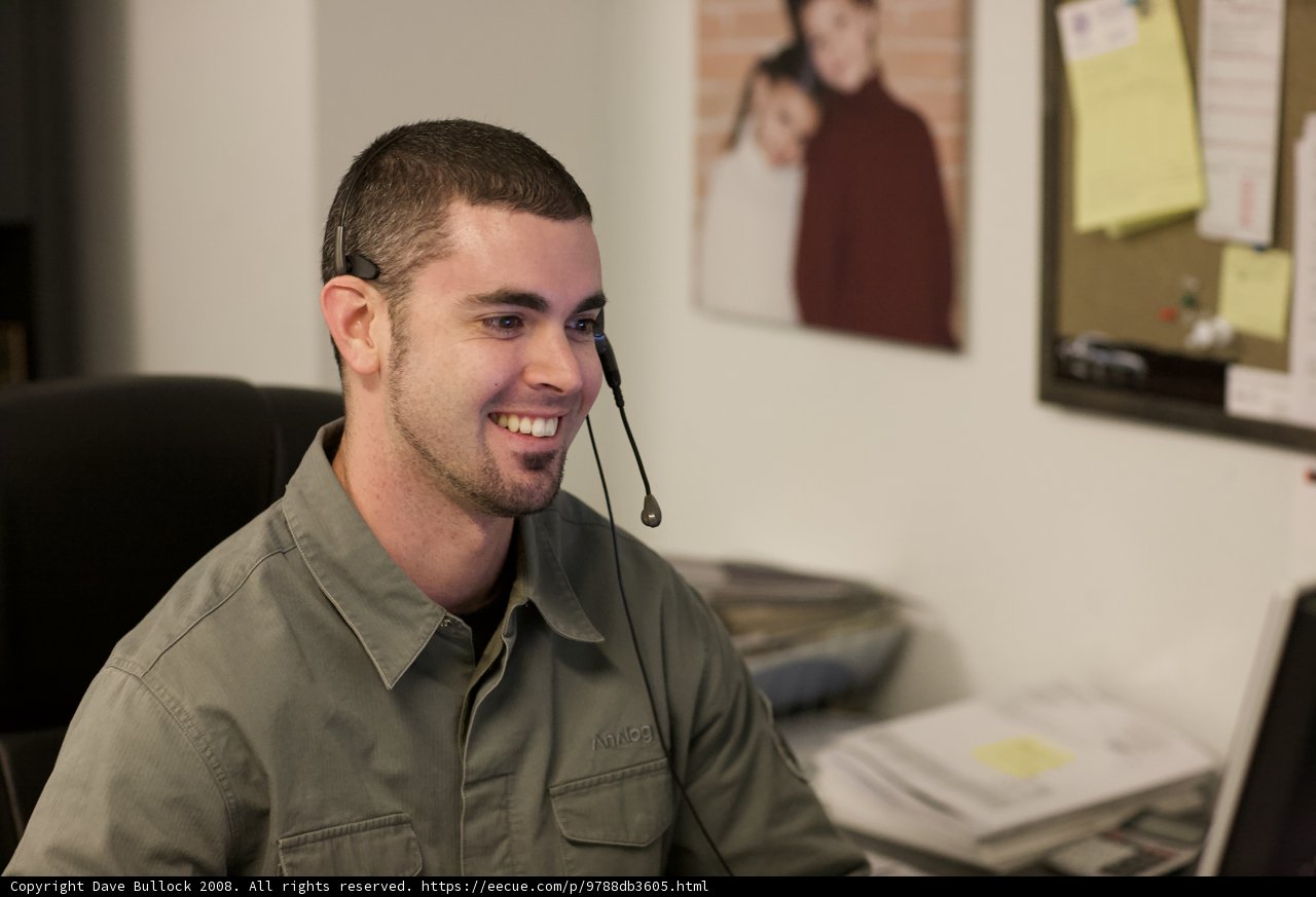 The Smiling Man in the Office