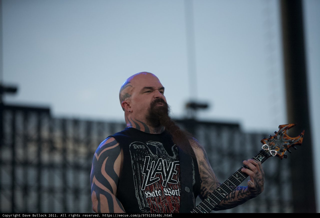 Kerry King shreds on his electric guitar under the blue sky at the Big Four Festival