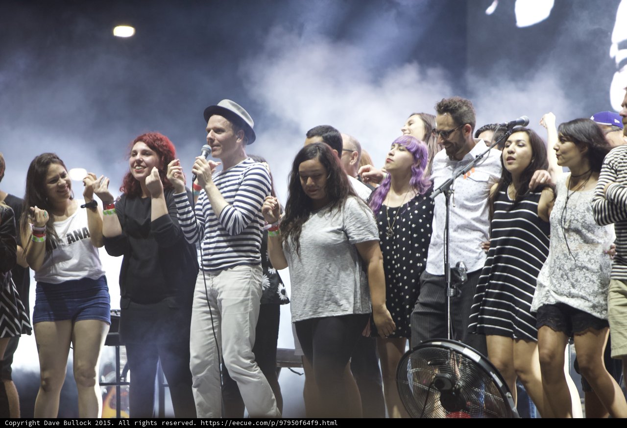 FYF Fest Stage Fedora Man Singing Red Hair Thumbs Up Purple Hair Glasses Man Dancing