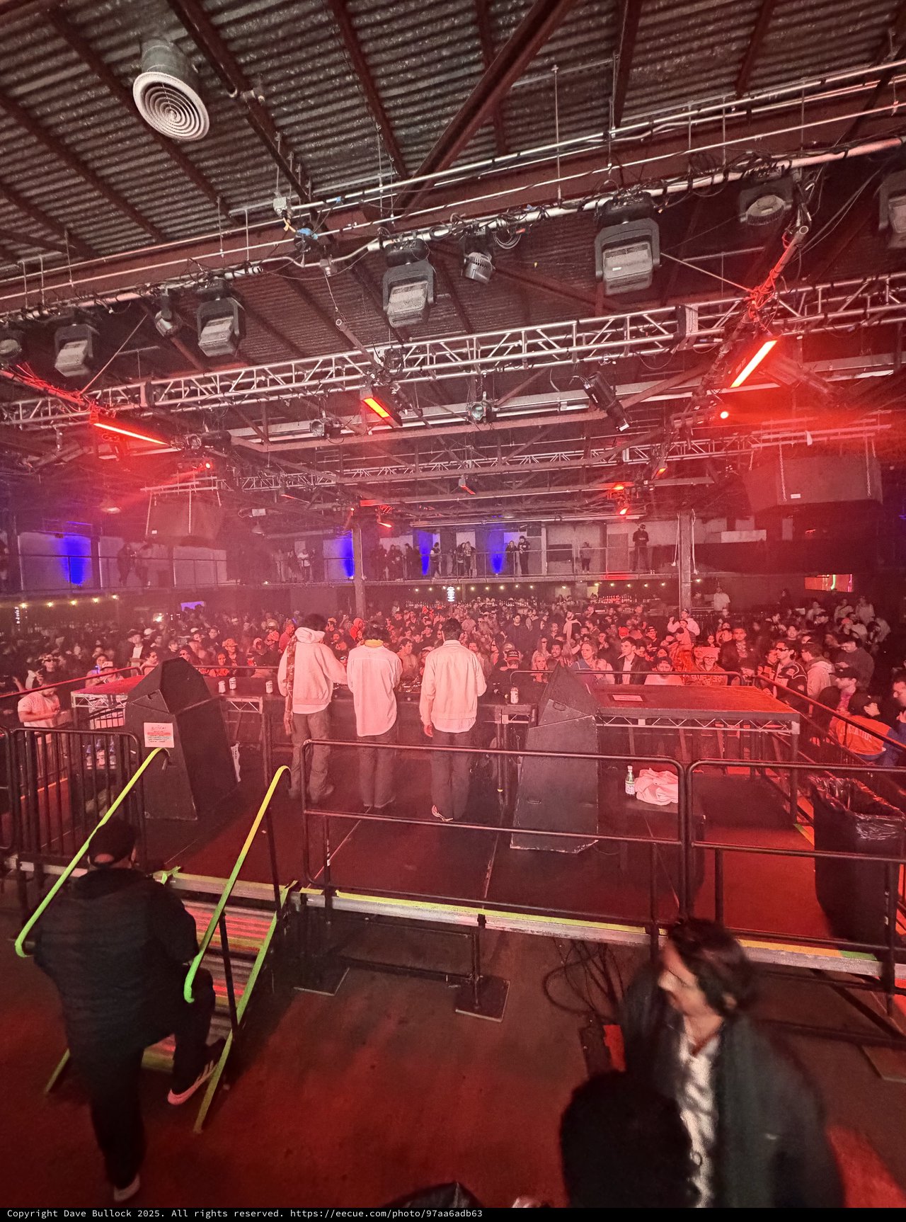 Electronic Music Event: Backstage View of Packed Venue
