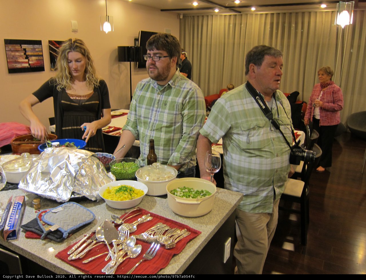 Friends Gather Around a Festive Holiday Dinner Spread