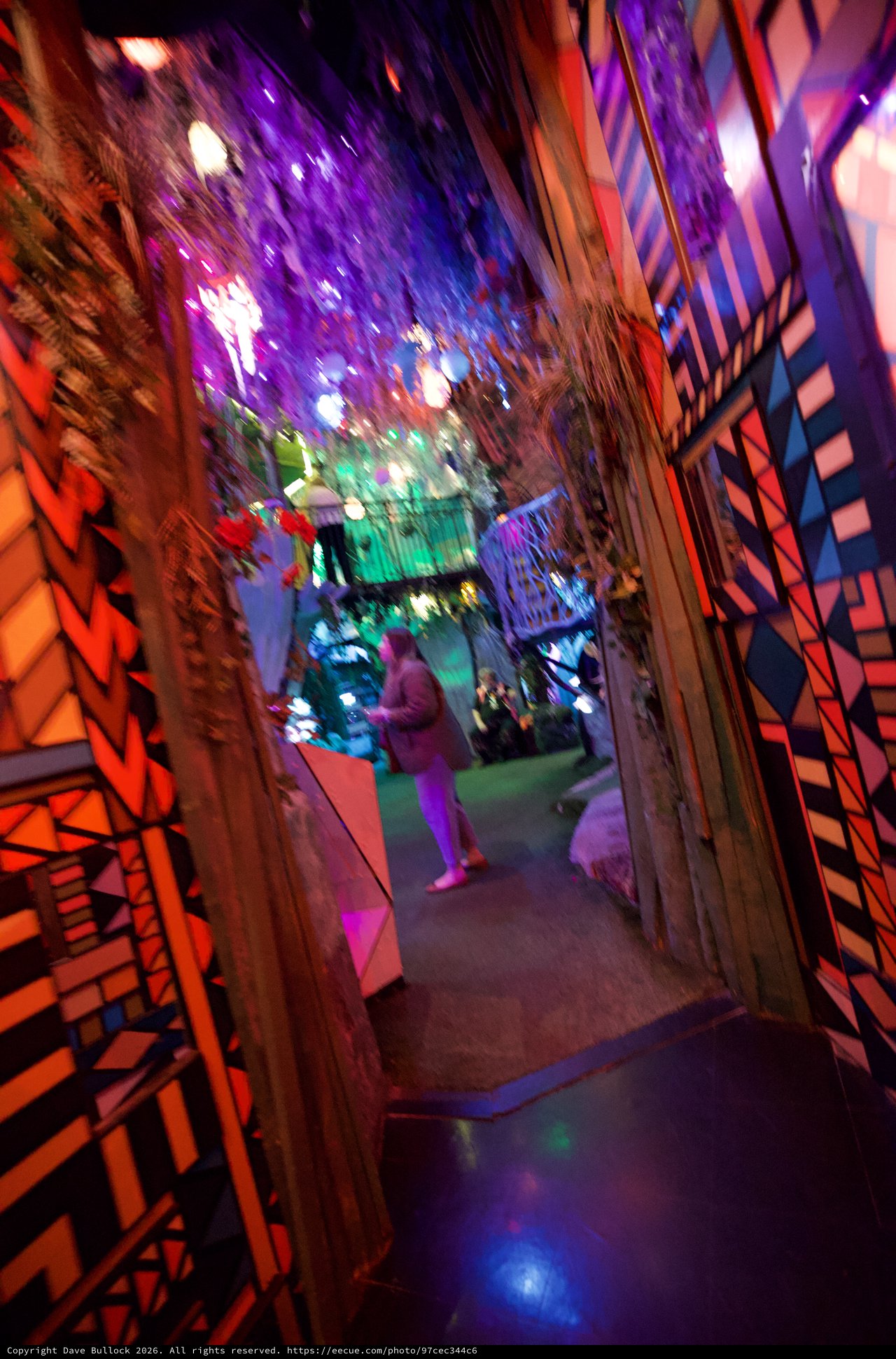 Kaleidoscopic Journey Through Illuminated Corridor