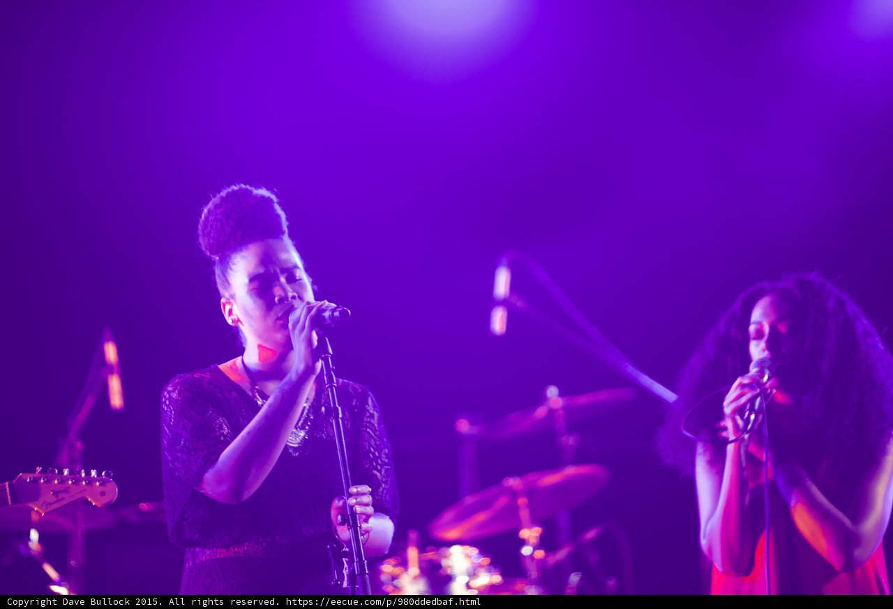 Solange And Backing Vocalist Singing Updo Red Dress Guitar Drum Kit Purple