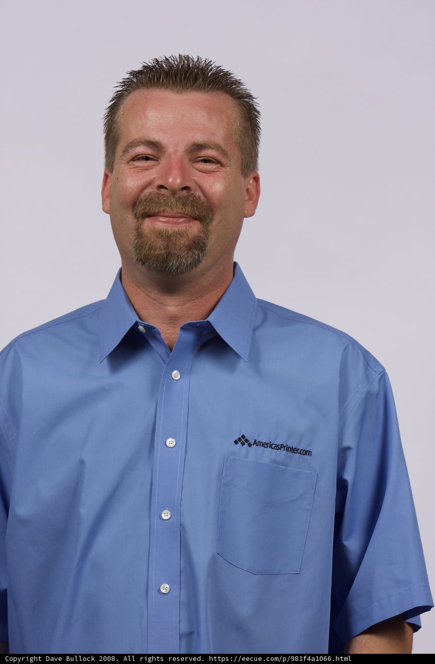 Blue-Shirted Man with a Beaming Smile