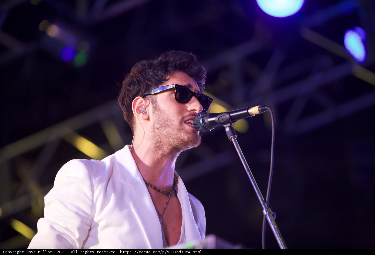Spotlight on the White Suit Singer