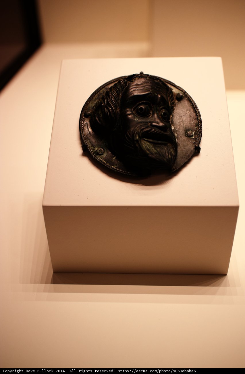Bronze Face Figurine on Wood Plaque