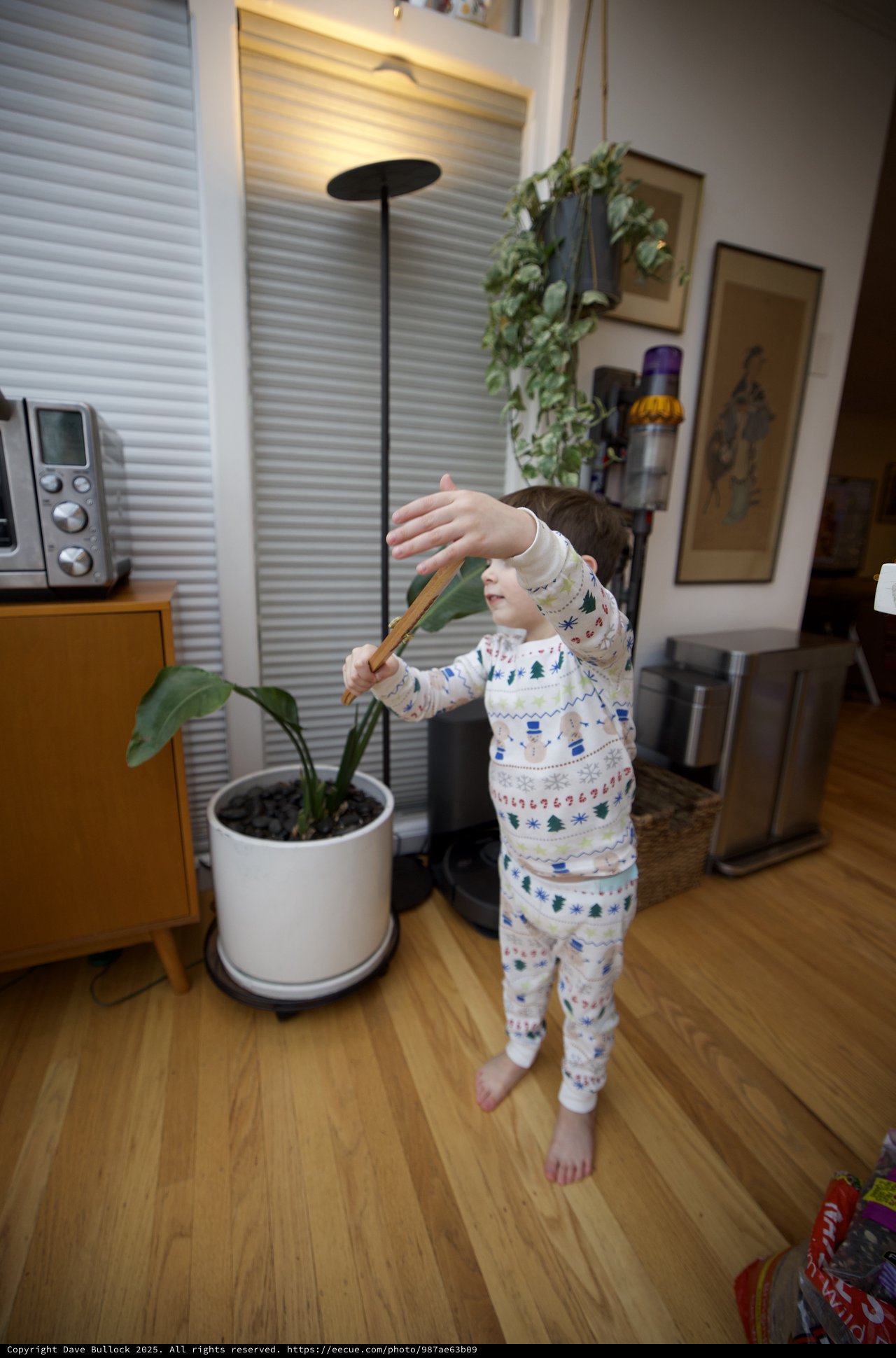Child in Holiday Pajamas Playing Indoors