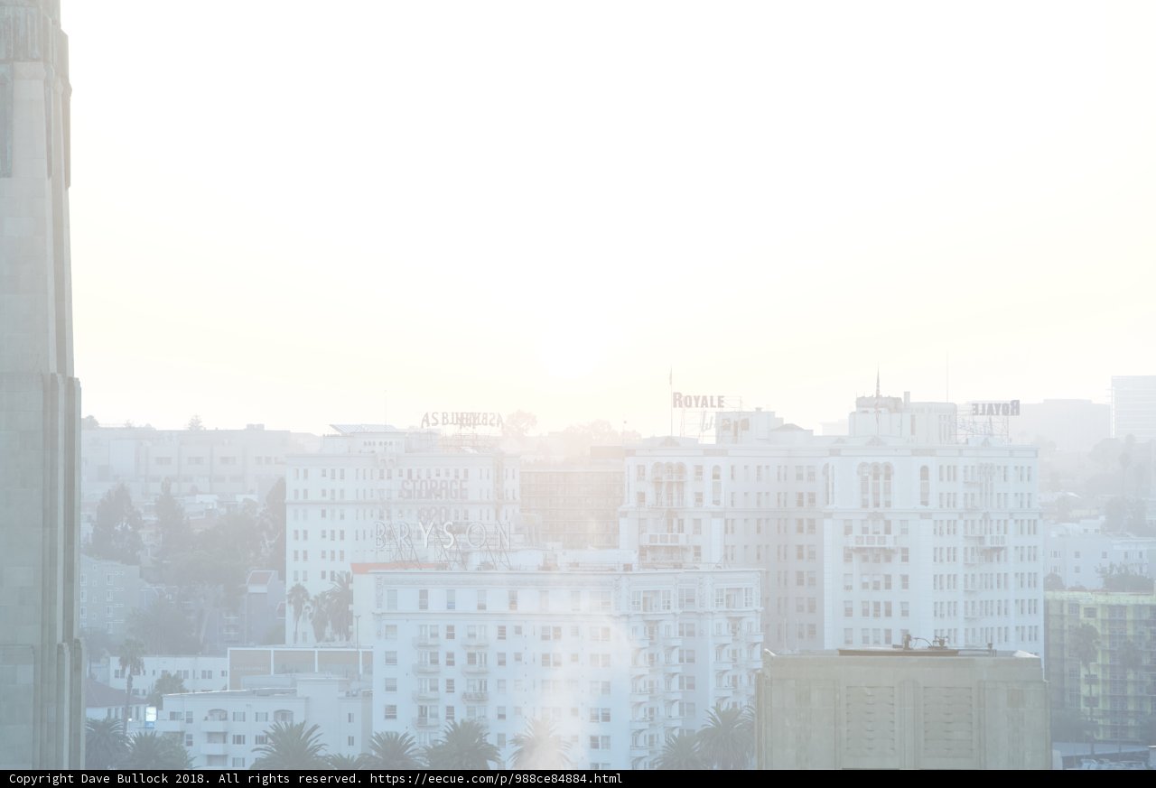 Kite-Flying Enthusiast Enjoys Hazy Cityscape