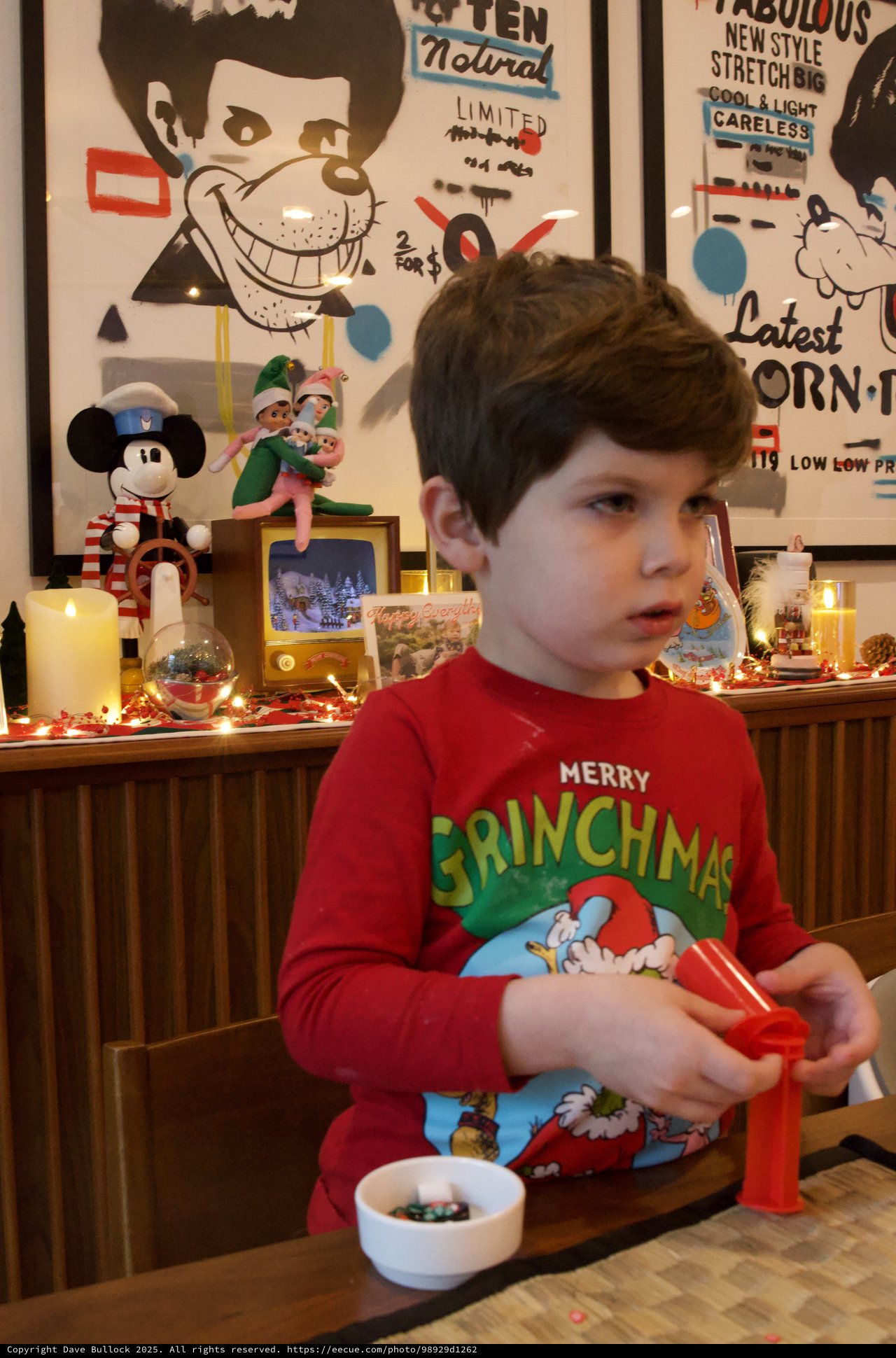 Child Opening Christmas Presents on Christmas Eve