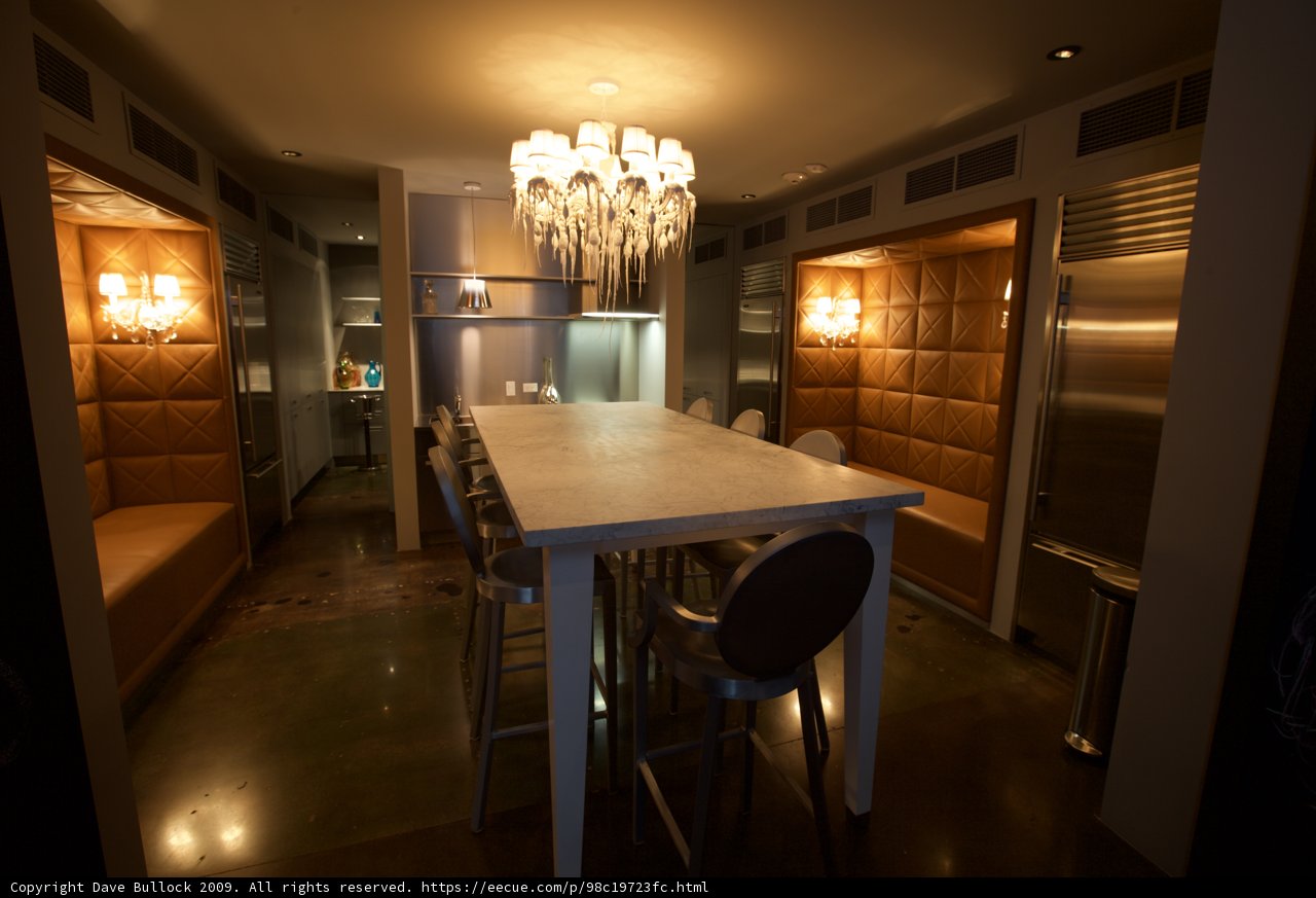 Elegant Dining Room with Chandelier and Hardwood Table