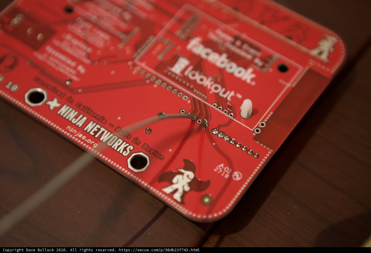 Red Circuit Board with a Ninja Badge Sticker
