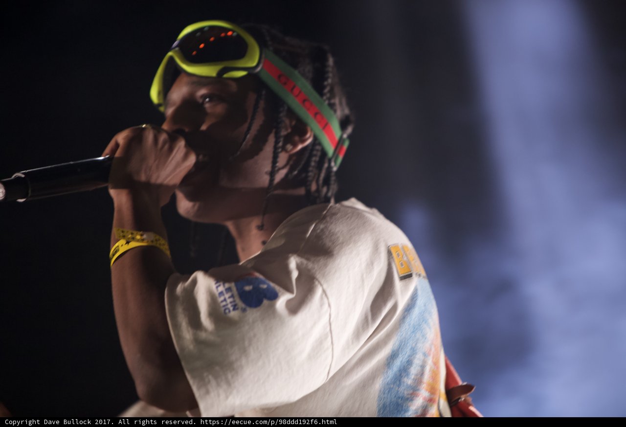 Dreadlocked Entertainer Takes the Stage with Microphone