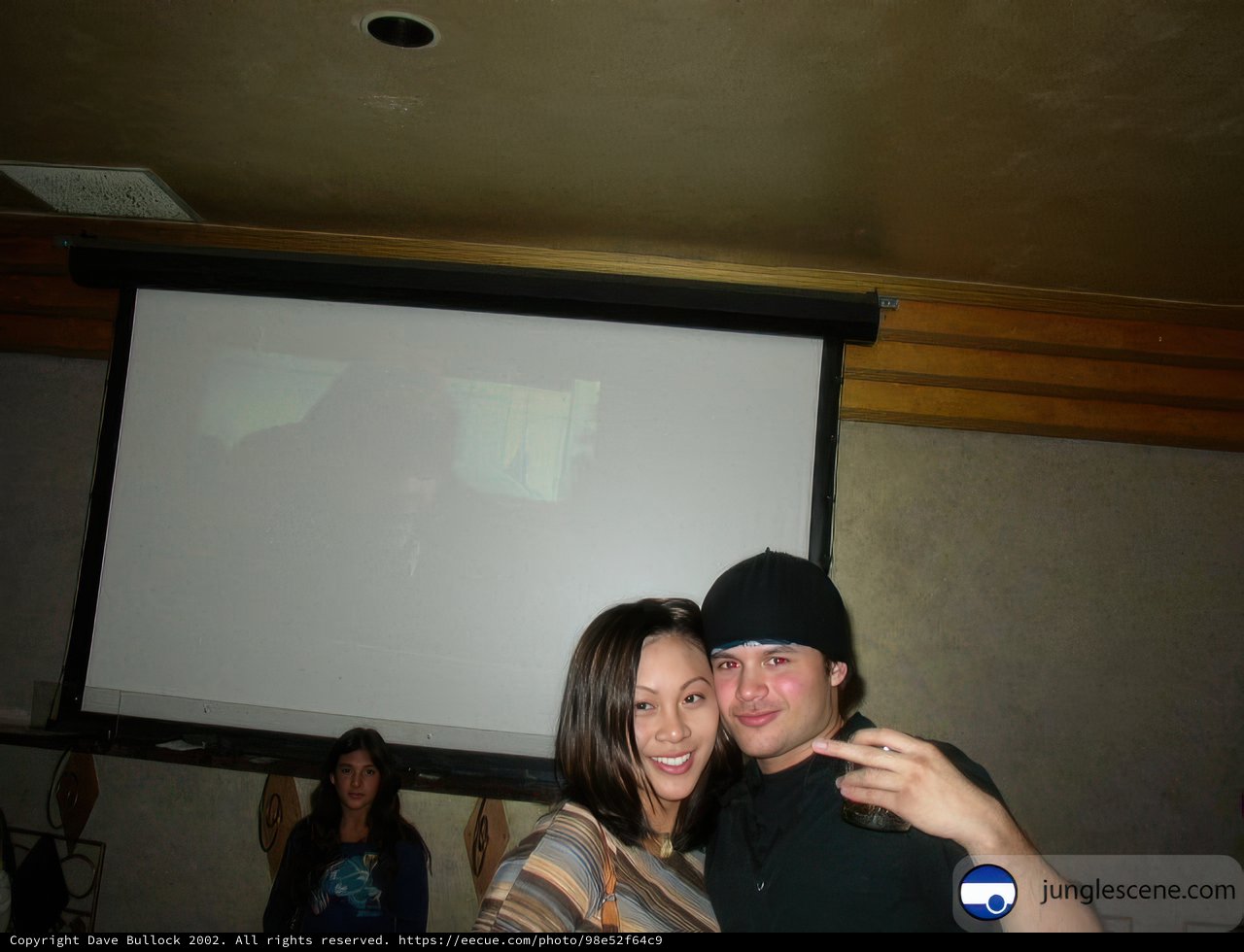 Posing in front of Projection Screen