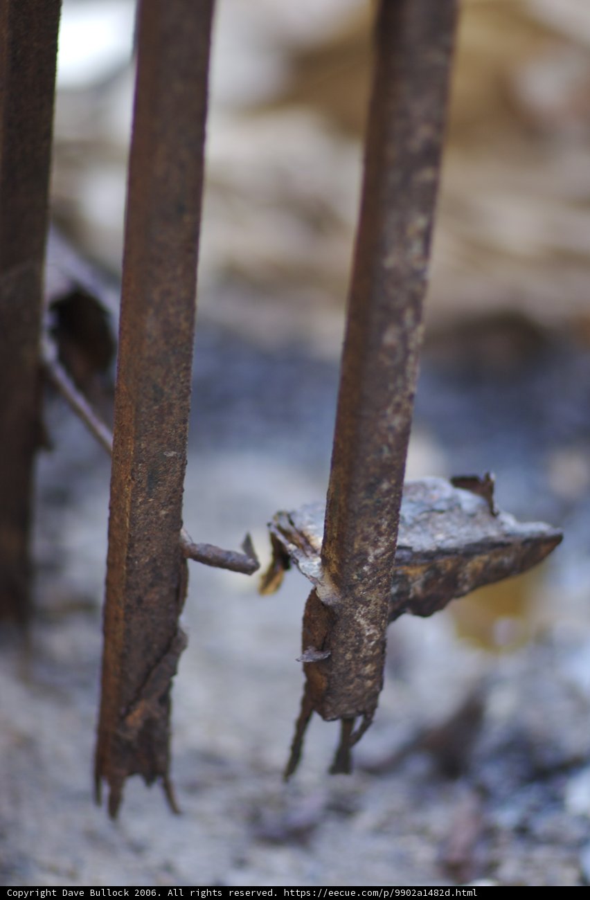 Rusty Fence with Intriguing Piece