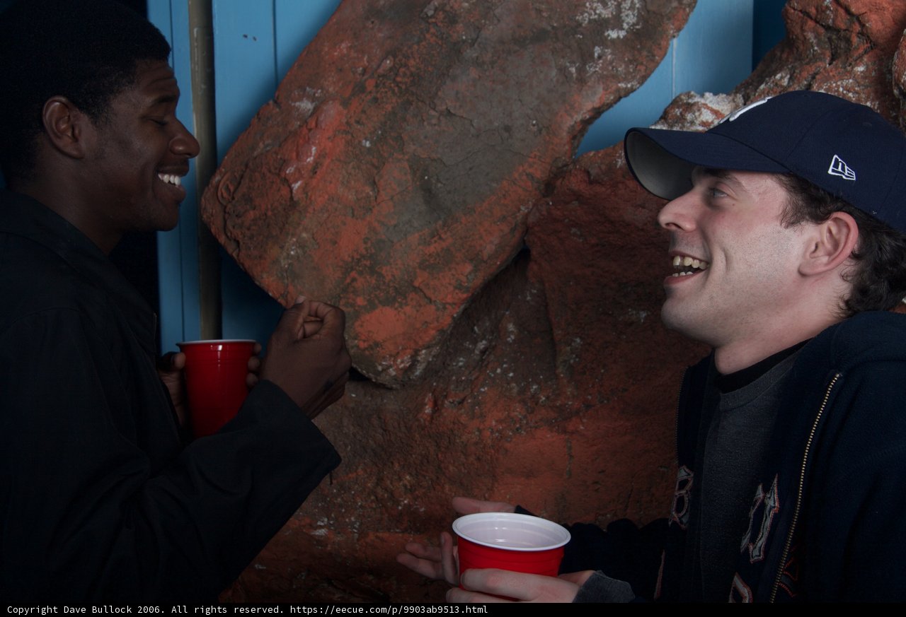 Blue-Jacketed Man enjoying Coffee with Friend on Halloween
