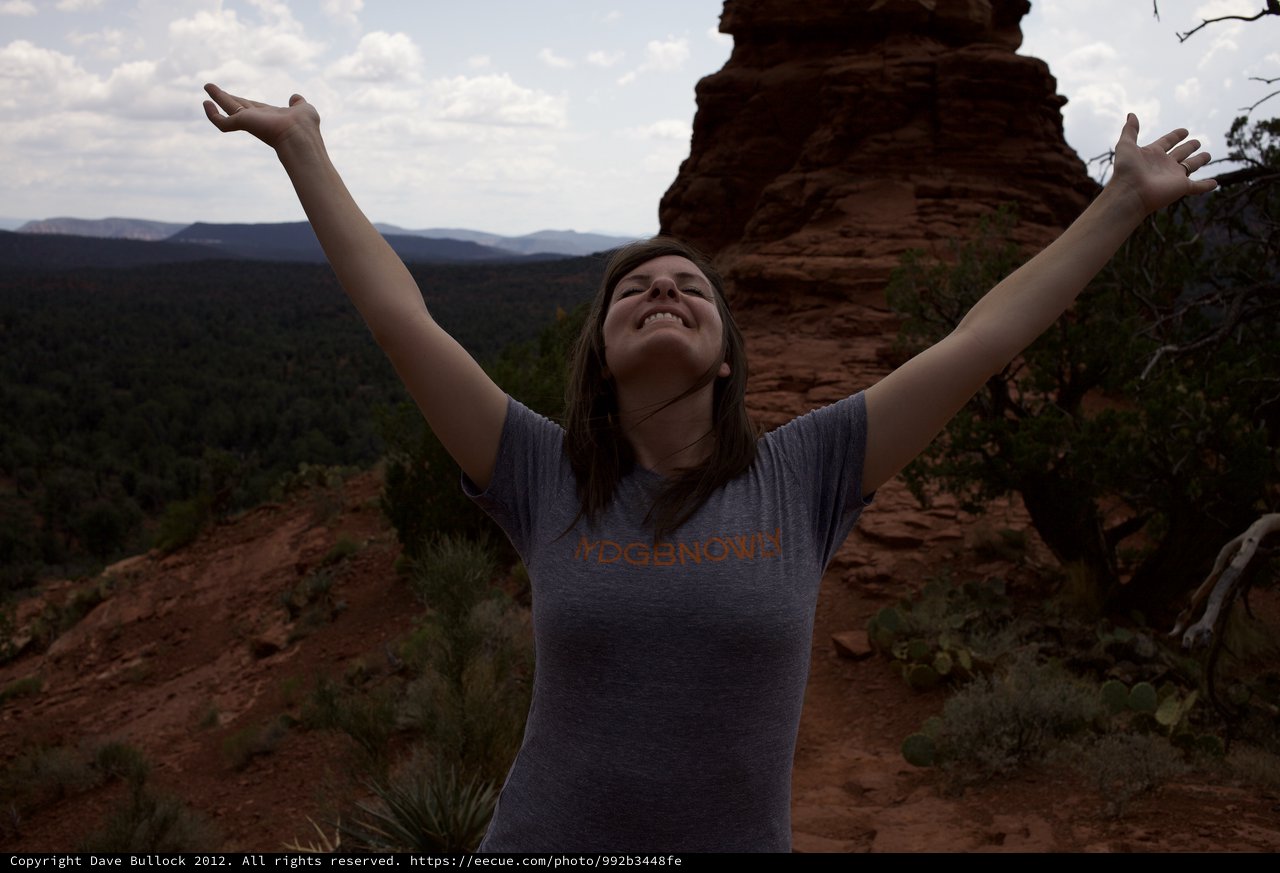 Joyful Woman Celebrates Atop Sedona Red Rock