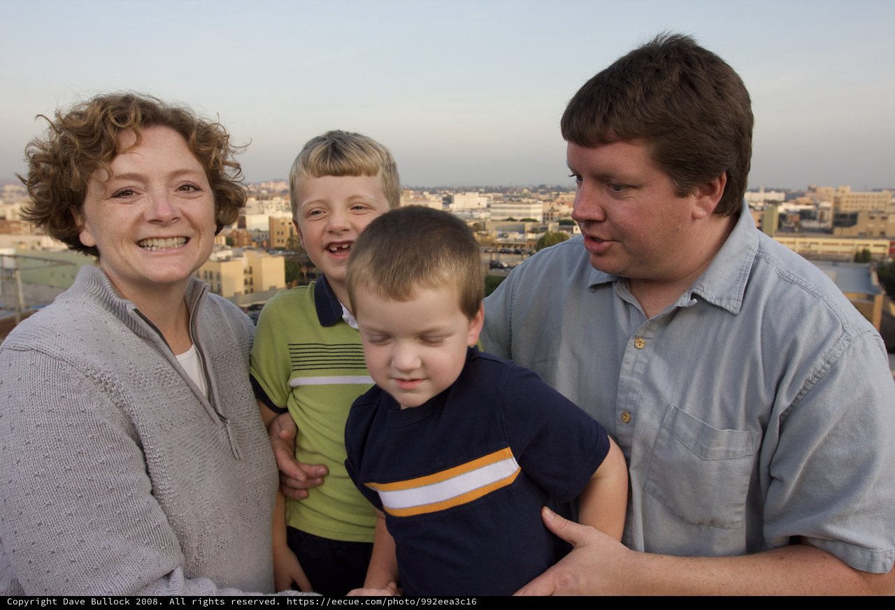 Family Portrait on Urban Rooftop at Dusk