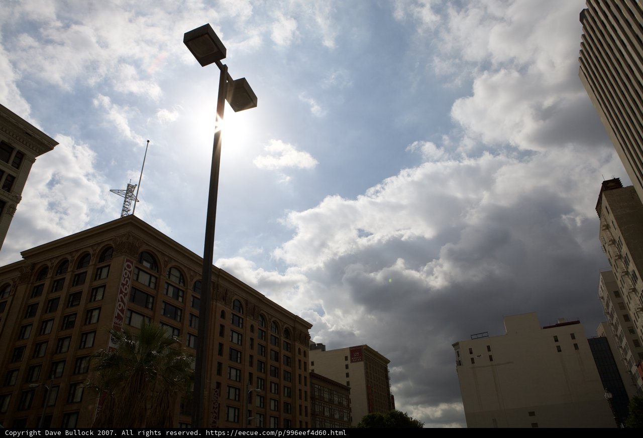 City Street Light Under Cloudy Sky