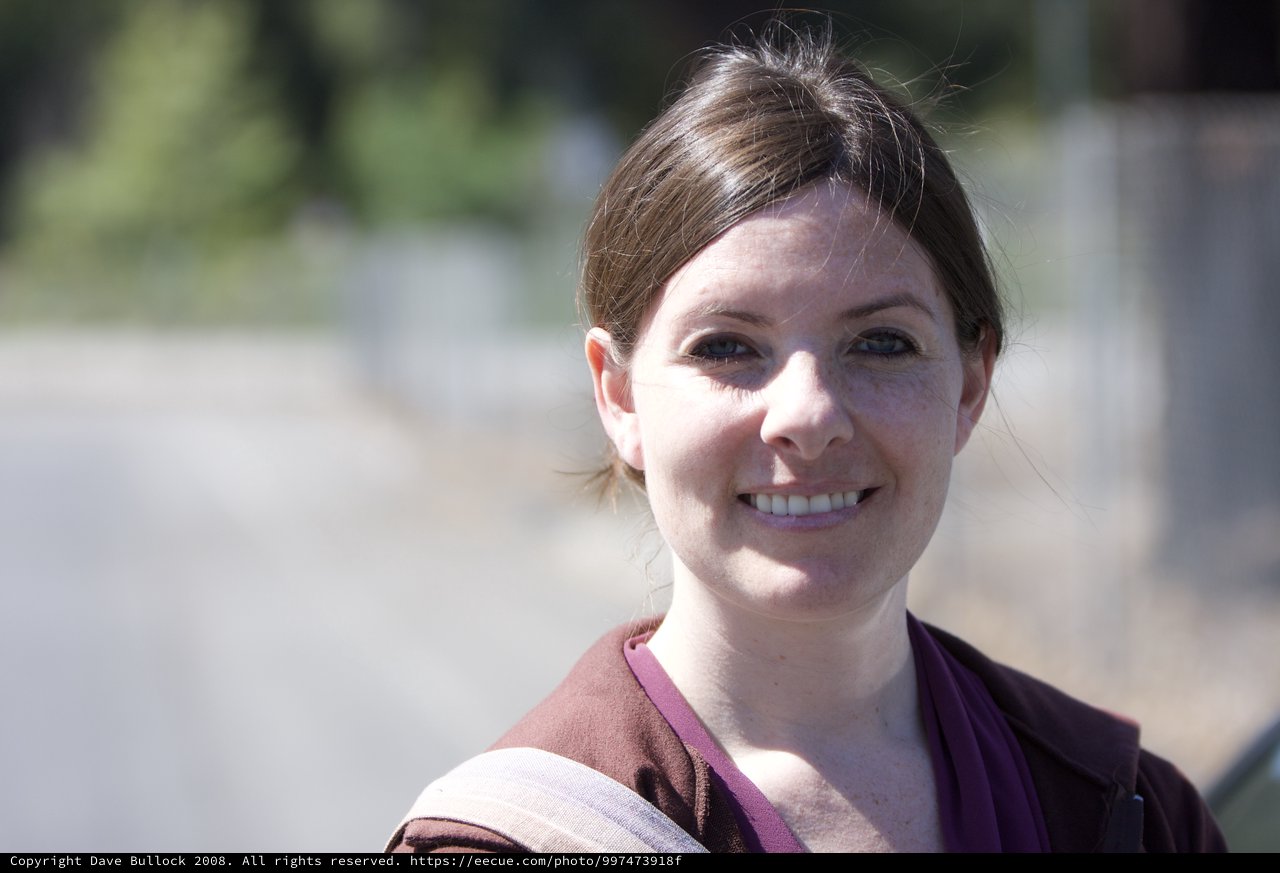 Smiling Woman Outdoors in Warm Natural Light